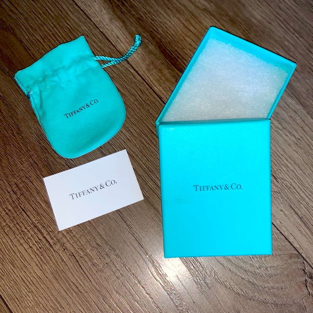 Tiffany & Co. jewelry box with Tiffany’s dust bag.